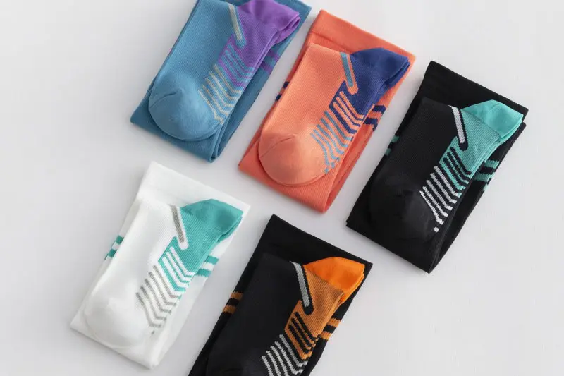 Compression sock sample check on leg for stretch cuff comfort and logo clarity