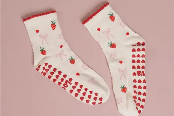 Grip sock case with sole grip pattern and studio branding