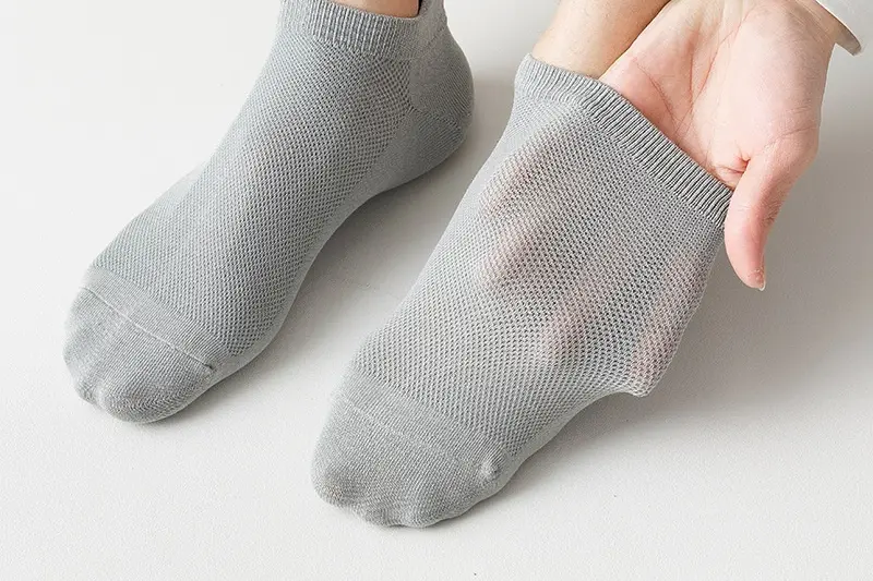 Breathable ankle sock materials with cotton blends mesh panels and stretch yarns