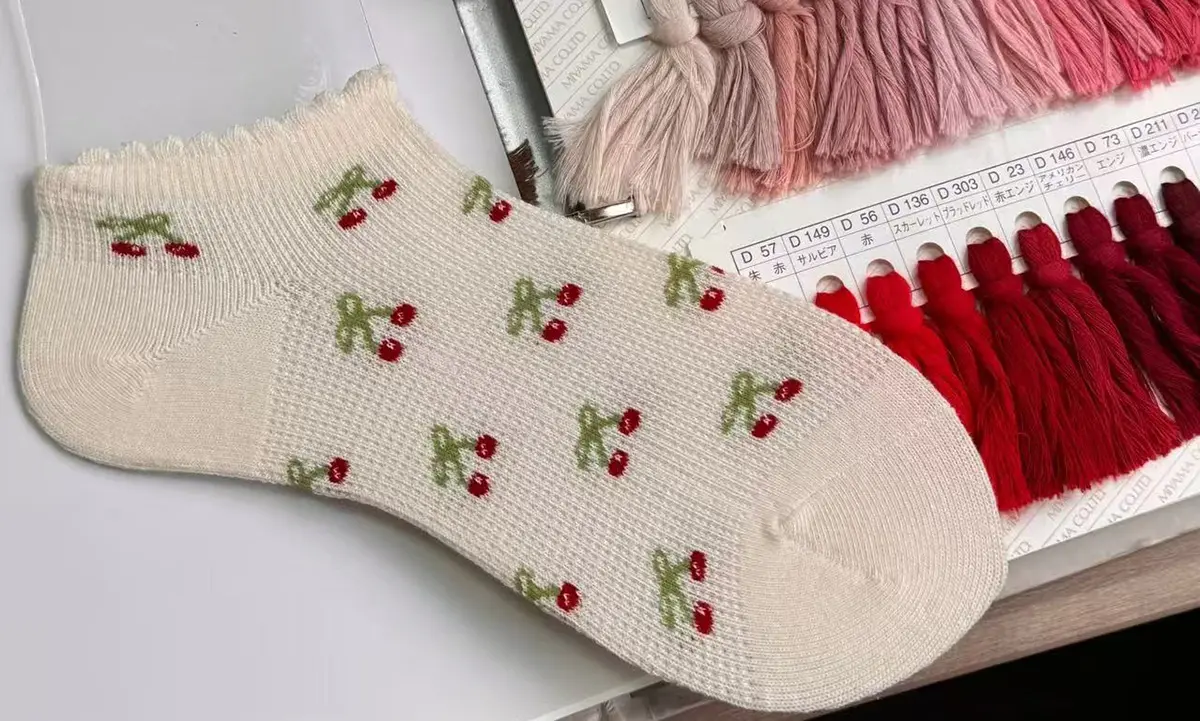 Custom ankle sock samples checked for height fit logo placement and material feel