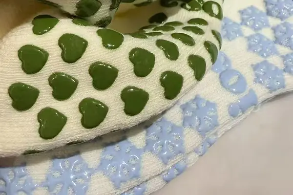 Grip sock materials for comfort stretch and indoor movement