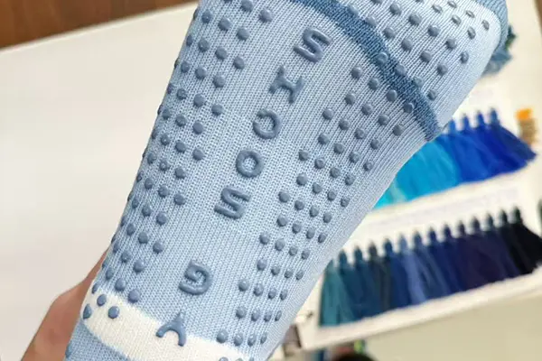 Logo and icon silicone grip branding on custom socks