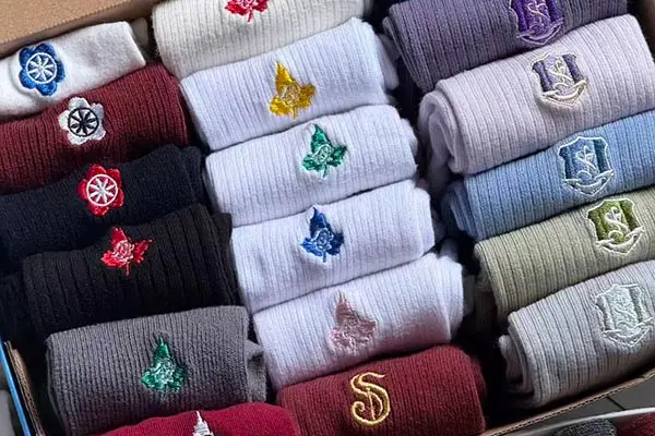 Embroidered logo detail on custom logo socks