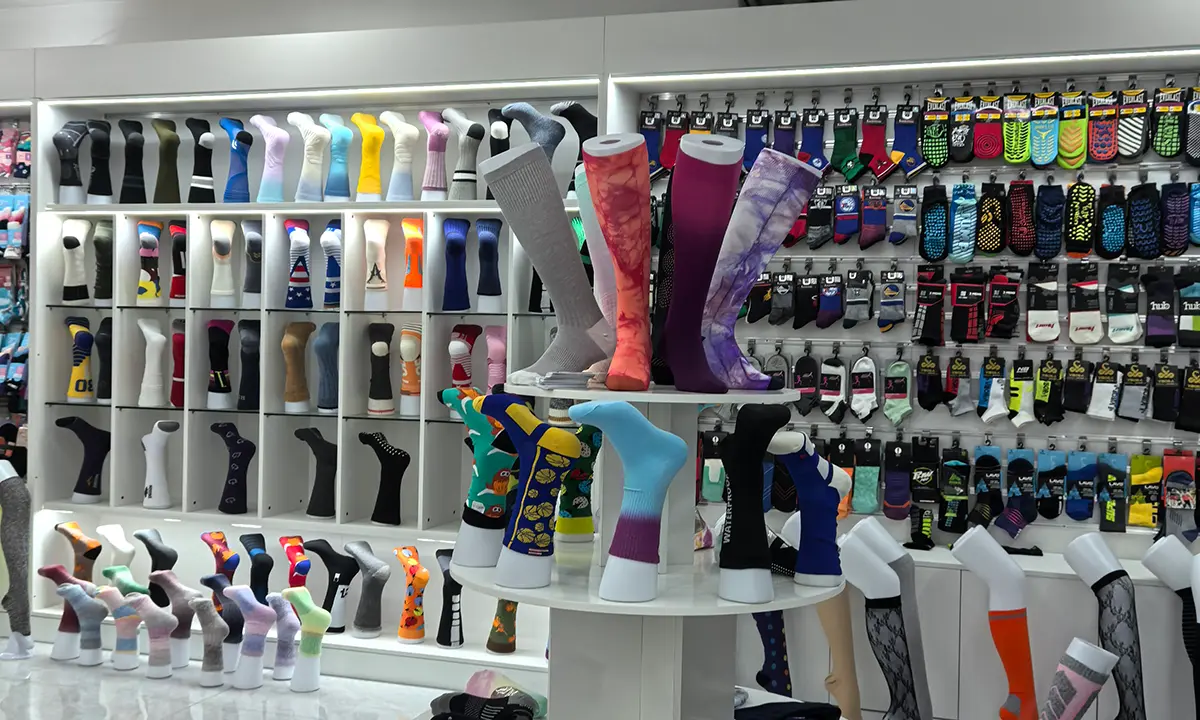 Custom sports sock samples for checking team colors logo placement and fit details