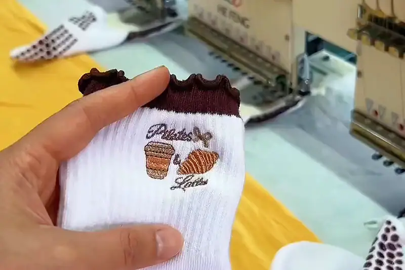 Custom embroidered socks with stitched logo detail