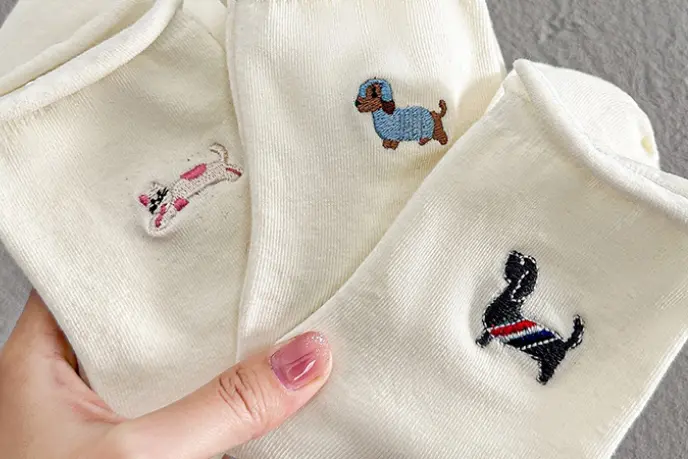 Raised embroidery detail on socks