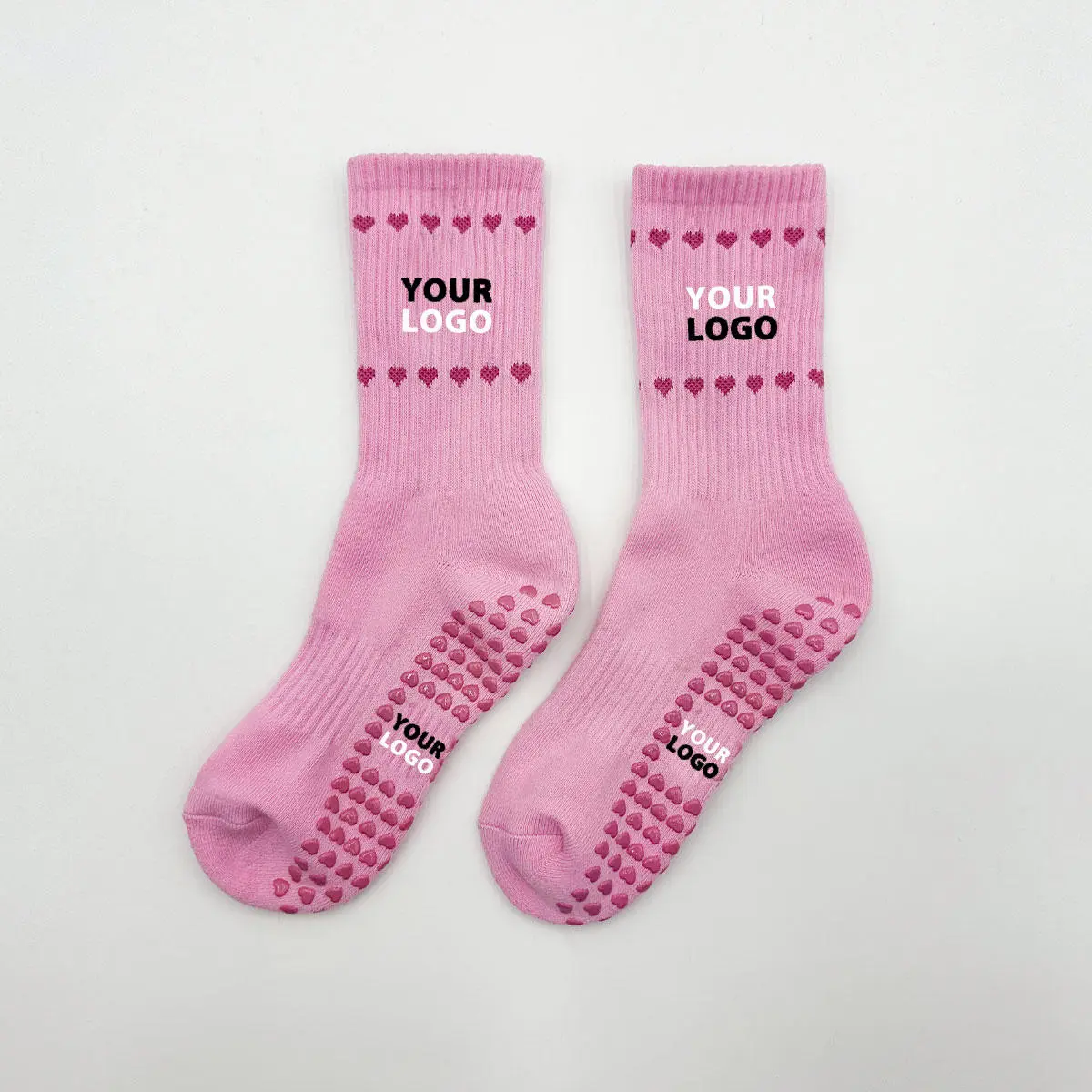 Custom Pilates grip socks with branded silicone sole details