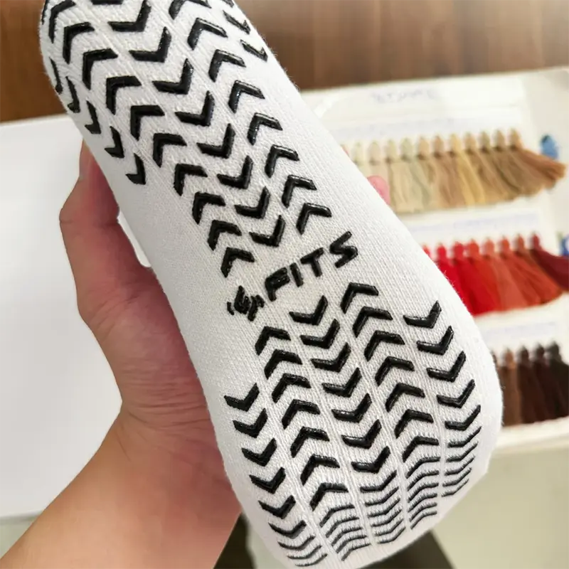 Custom color yoga grip socks for retreat and retail programs