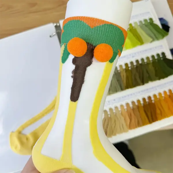 Personalized novelty logo socks manufactured with custom patterns colors and packaging