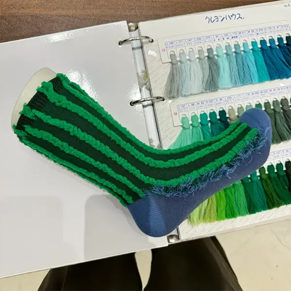 Pattern detail on novelty socks prepared for promotional production