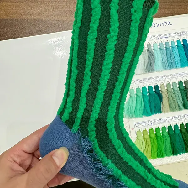 Yarn and color detail for custom novelty socks with logo